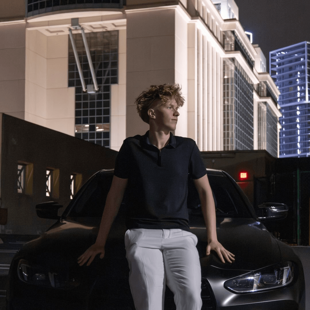 Paul Hogan standing in front of his BMW M4 Competition